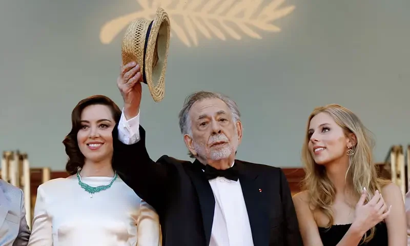 Director Francis Ford Coppola poses on the red carpet with cast members Aubrey Plaza and Romy Coppola, during arrivals for the screening of the film "Megalopolis" in competition at the 77th Cannes Film Festival in Cannes, France, May 16, 2024. REUTERS/Clodagh Kilcoyne