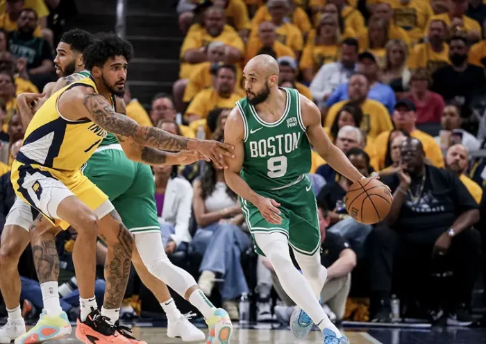 Boston Celtics guard Derrick White (9) dribbles the ball during the second quarter during game four of the eastern conference finals for the 2024 NBA playoffs at Gainbridge Fieldhouse. Mandatory Credit: Trevor Ruszkowski-USA TODAY Sports