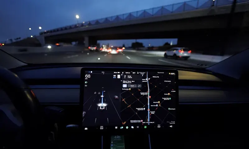 A Tesla Model 3 vehicle drives on autopilot along the 405 highway in Westminster, California, U.S., March 16, 2022. REUTERS/Mike Blake/File Photo
