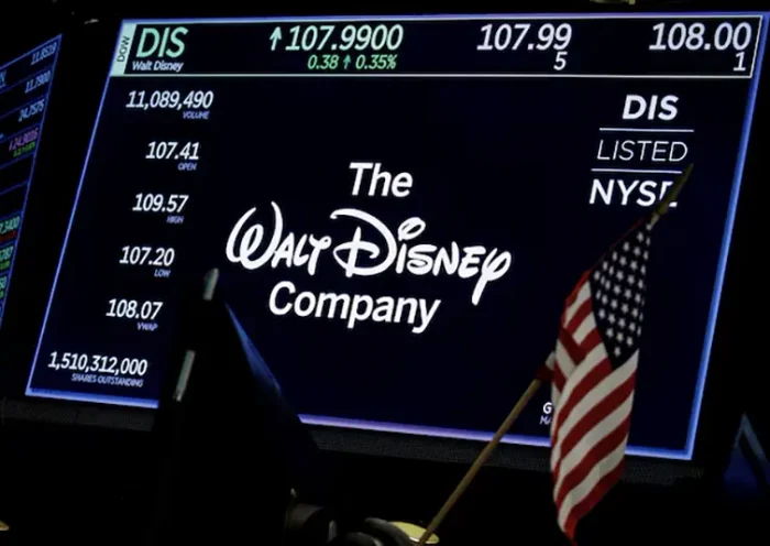 A screen shows the logo and a ticker symbol for The Walt Disney Company on the floor of the New York Stock Exchange (NYSE) in New York, U.S., December 14, 2017. REUTERS/Brendan McDermid/File Photo