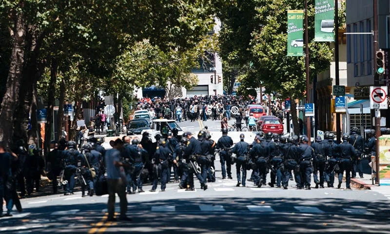 BERKELEY, CA - AUGUST 05: Hundreds of counter-protestors attempt to make their way as Berkeley Police blockade the roads to the Martin Luther King Jr. Civic Center Park on August 5, 2018 in Berkeley, California. Demonstrators gathered in Berkeley to protest the anti-communist rally. (Photo by Mason Trinca/Getty Images)