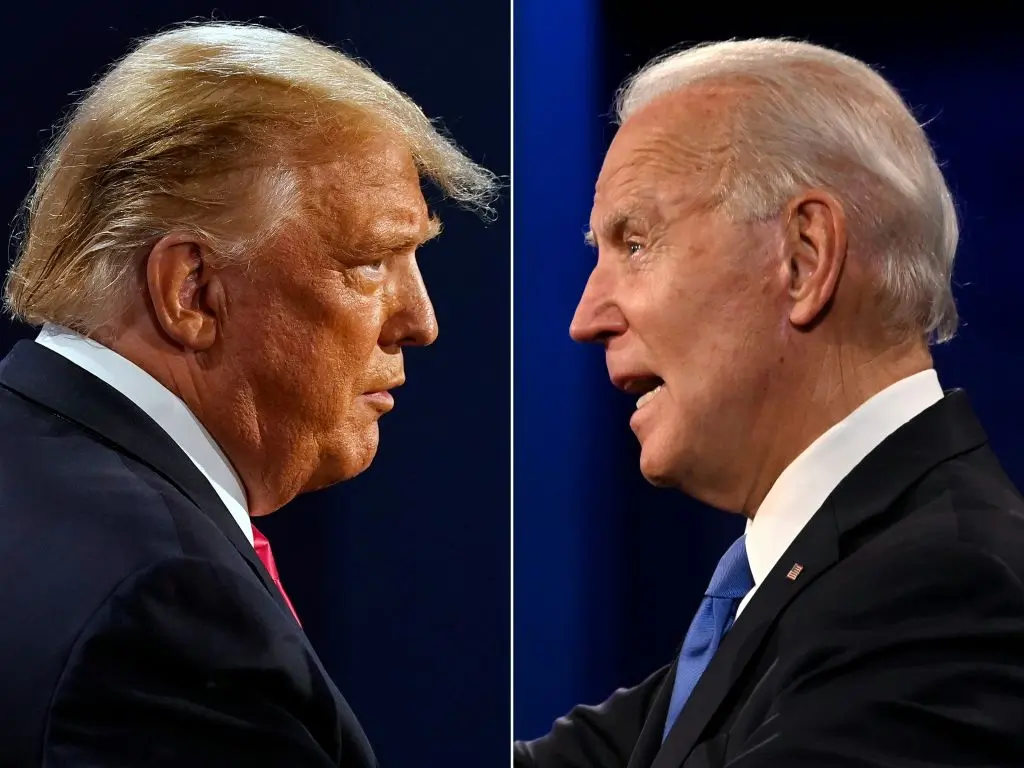 (COMBO) This combination of pictures created on October 22, 2020 shows US President Donald Trump (L) and Democratic Presidential candidate and former US Vice President Joe Biden during the final presidential debate at Belmont University in Nashville, Tennessee, on October 22, 2020. (Photos by Morry GASH and JIM WATSON / AFP) (Photo by MORRY GASH,JIM WATSON/AFP via Getty Images)