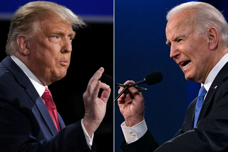 TOPSHOT - (COMBO) This combination of pictures created on October 22, 2020 shows US President Donald Trump (L) and Democratic Presidential candidate and former US Vice President Joe Biden during the final presidential debate at Belmont University in Nashville, Tennessee, on October 22, 2020. (Photo by Brendan Smialowski and JIM WATSON / AFP) (Photo by BRENDAN SMIALOWSKIJIM WATSON/AFP via Getty Images)