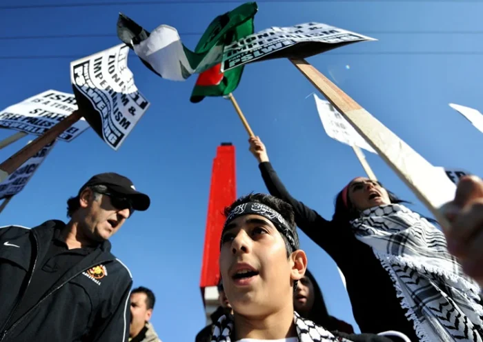 Protesters shout anti-Israeli slogans during a demonstration in Anaheim, California, on January 4, 2009. Israel did not ask for US backing in advance of a ground offensive into Gaza, US Vice President Dick Cheney said January 4, as tens of thousands of Israeli troops backed by tanks pounded the Palestinian enclave. AFP PHOTO/Jewel SAMAD (Photo by Jewel SAMAD / AFP) (Photo by JEWEL SAMAD/AFP via Getty Images)