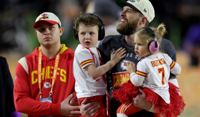 GLENDALE, ARIZONA - FEBRUARY 12: Harrison Butker #7 of the Kansas City Chiefs celebrates with his children after kicking the go ahead field goal to beat the Philadelphia Eagles in Super Bowl LVII at State Farm Stadium on February 12, 2023 in Glendale, Arizona. (Photo by Carmen Mandato/Getty Images)