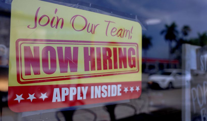 MIAMI, FLORIDA - MAY 05: A 'Now Hiring' sign posted in the window of a restaurant looking to hire workers on May 05, 2023 in Miami, Florida. A report by the Bureau of Labor Statistics showed the US economy added 253,000 jobs in April. (Photo by Joe Raedle/Getty Images)