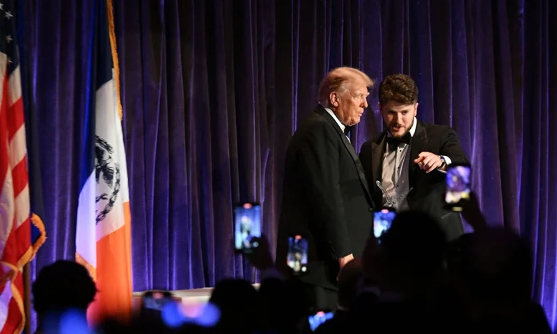 Former US President and presidential hopeful Donald Trump and New York Young Republican Club president Gavin M. Wax speak at the New York Young Republican Club's 111th annual gala in New York on December 9, 2023. (Photo by ANGELA WEISS / AFP) (Photo by ANGELA WEISS/AFP via Getty Images)