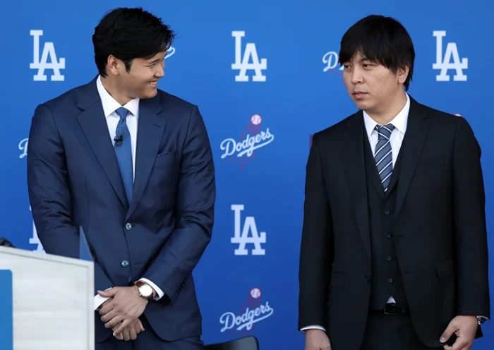 Los Angeles Dodgers Introduce Shohei Ohtani LOS ANGELES, CALIFORNIA - DECEMBER 14: Shohei Ohtani speaks with his interpreter Ippei Mizuhara prior to being introduced by the Los Angeles Dodgers at Dodger Stadium on December 14, 2023 in Los Angeles, California. (Photo by Meg Oliphant/Getty Images)