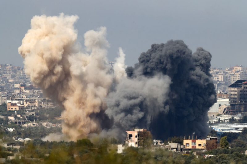 This picture taken from Israel's southern border with the Gaza Strip shows smoke billowing following an Israeli strike in the besieged Palestinian territory on March 27, 2024, amid the ongoing conflict between Israel and the militant group Hamas. (Photo by JACK GUEZ / AFP) (Photo by JACK GUEZ/AFP via Getty Images)