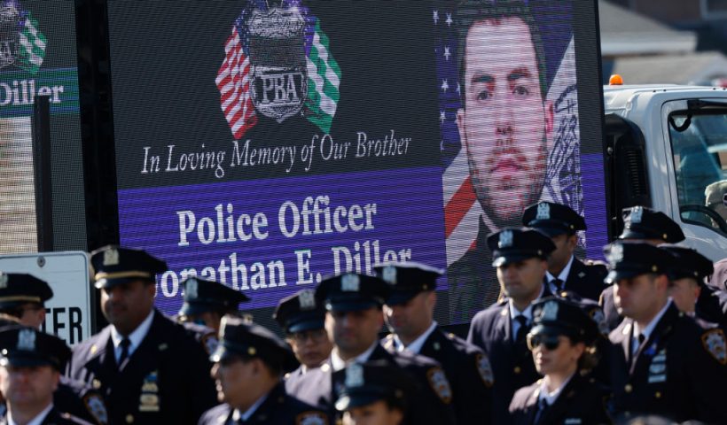 MASSAPEQUA, NEW YORK - MARCH 30: People attend the funeral of NYPD officer Jonathan Diller at St. Rose of Lima R.C. Church on March 30, 2024 in Massapequa, New York. Officer Diller was killed on March 25th when he was shot in Queens after approaching an illegally parked vehicle. Two suspects have been arrested, charged and are being held and without bail for the murder of Diller. (Photo by Michael M. Santiago/Getty Images)