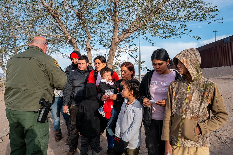 EL PASO, TEXAS - APRIL 02: A group of migrants wait to be processed after crossing the Rio Grande river on April 02, 2024 in El Paso, Texas. Last week, hundreds of migrants seeking asylum clashed with Texas national guardsmen while waiting to turn themselves in to border patrol agents for processing. Texas continues awaiting a verdict on Senate Bill 4. Attorneys representing the state of Texas are scheduled to return to the Fifth Circuit Court of Appeals in New Orleans on April 3 to continue arguing for the constitutional basis of the bill. Senate Bill 4 allows state law enforcement officials to detain and arrest undocumented immigrants suspected of illegally crossing into the United States. Thus far, all prior attempts to put the Bill into effect have been blocked by the Fifth Circuit Court of Appeals. (Photo by Brandon Bell/Getty Images)