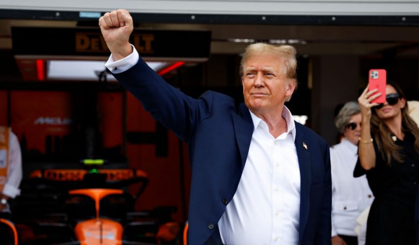 MIAMI, FLORIDA - MAY 05: Donald Trump gestures in the Pitlane prior to the F1 Grand Prix of Miami at Miami International Autodrome on May 05, 2024 in Miami, Florida. (Photo by Chris Graythen/Getty Images)
