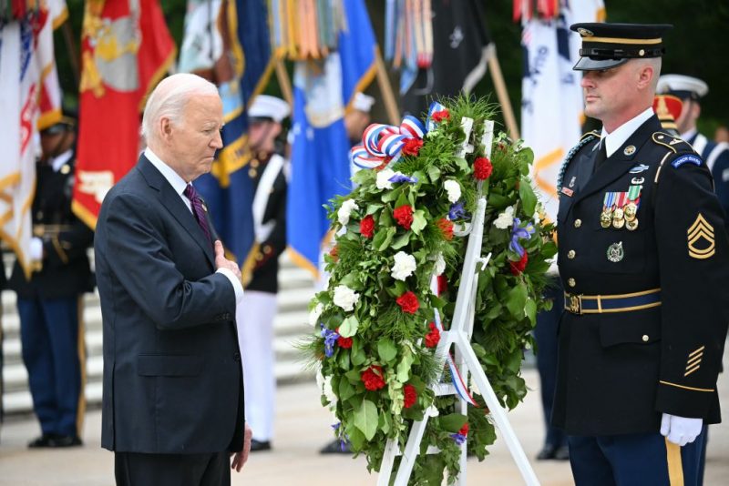US President Joe Biden participates in a wreath laying ceremony at the Tomb of the Unknown Soldier at Arlington National Cemetery, in observance of Memorial Day on May 27, 2024, in Arlington, Virginia. (Photo by Mandel NGAN / AFP) (Photo by MANDEL NGAN/AFP via Getty Images)