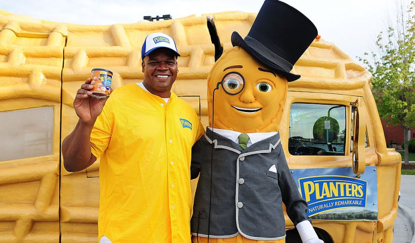 WINNETKA, IL - AUGUST 06: MLB Hall of Famer Frank Thomas poses with Mr. Peanut in front of the Planters NUTmobile during the Planters Power Hitter Event at the Skokie Playfields on August 6, 2014 in Winnetka, Illinois. (Photo by Timothy Hiatt/Getty Images for Planters)