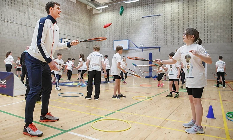 DUNBLANE, SCOTLAND - APRIL 26: Jamie Murray takes a tennis session with pupils in the sports hall at Dunblane High School on April 26, 2016 in Dunblane, Scotland. (Photo by Steve Welsh/Getty Images for LTA)