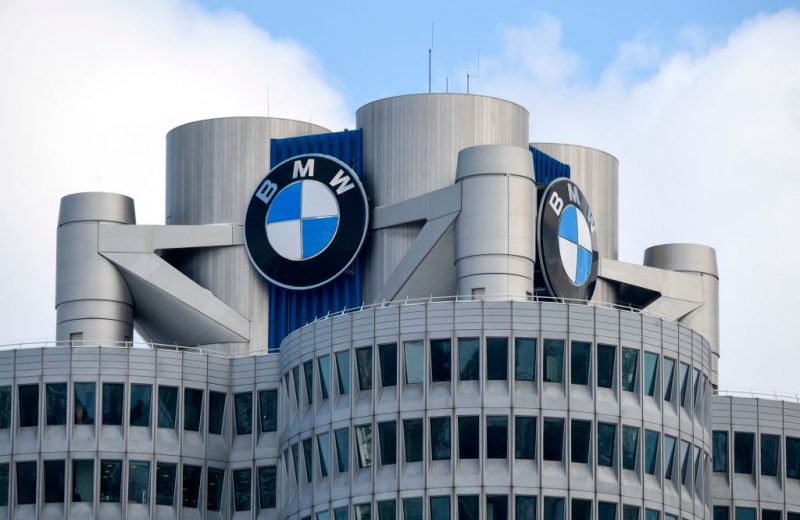The BMW logo is seen on the top of the headquarters of German carmaker BMW in Munich on March 20, 2018.