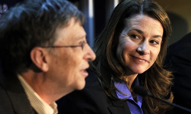 Microsoft founder Bill Gates (L) and his Microsoft founder Bill Gates (L) and his wife Melinda smile during a press conference on their "Bill & Melinda Gates Foundation" on the third day of the World Economic Forum (WEF) annual meeting on January 29, 2010 in Davos. Gates announced that his Foundation will commit 10 billion dollars over the next decade to research and deliver vaccines to the world's poorest countries. AFP PHOTO / FABRICE COFFRINI (Photo credit should read FABRICE COFFRINI/AFP via Getty Images)