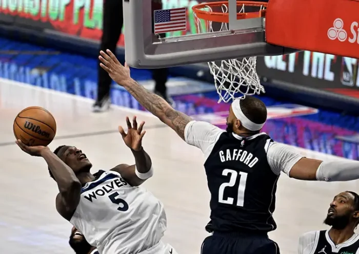 Minnesota Timberwolves guard Anthony Edwards (5) shoots over Dallas Mavericks center Daniel Gafford (21) during the second half in game four of the western conference finals for the 2024 NBA playoffs at American Airlines Center. Mandatory Credit: Jerome Miron-USA TODAY Sports