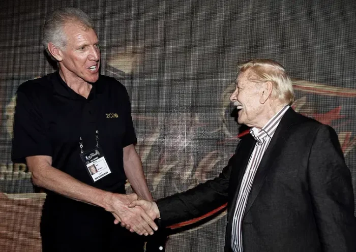 Fomer NBA star Bill Walton (L) talks with Los Angeles Lakers team owner Jerry Buss after the Lakers defeated the Boston Celtics in Game 7 of the 2010 NBA Finals basketball series in Los Angeles, California June 17, 2010. REUTERS/Mike Blake/File Photo