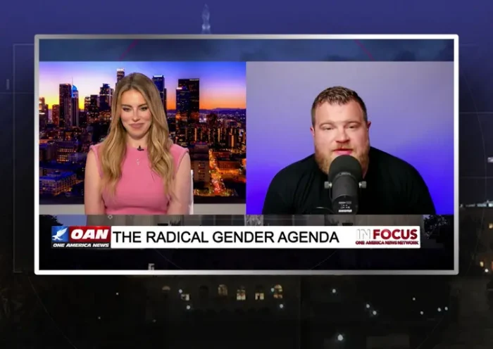 Video still from In Focus on One America News Network showing a split screen of the host on the left side, and on the right side is the guest, Ross Duh Boss.