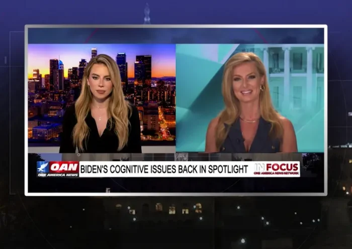 Video still from In Focus on One America News Network showing a split screen of the host on the left side, and on the right side is the guest, Emerald Robinson.