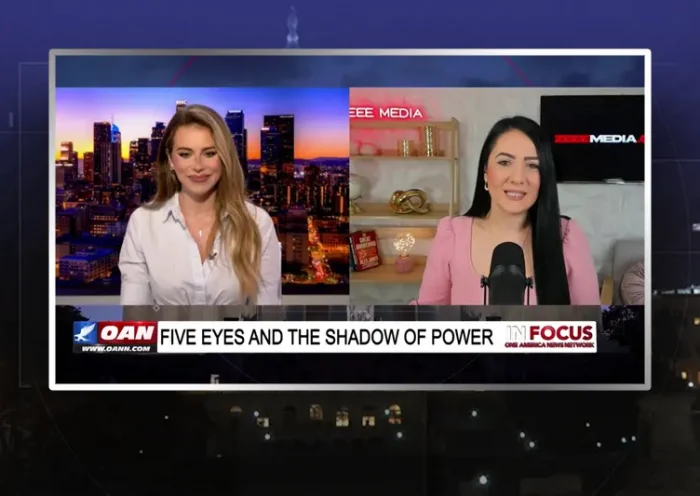 Video still from In Focus on One America News Network showing a split screen of the host on the left side, and on the right side is the guest, Maria Zeee.