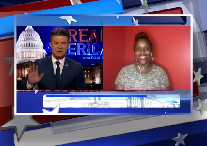 Video still from Real America on One America News Network showing a split screen of the host on the left side, and on the right side is the guest, P Rae Easley.
