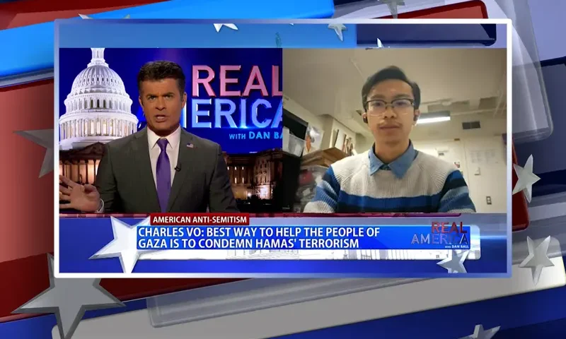 Video still from Real America on One America News Network showing a split screen of the host on the left side, and on the right side is the guest, Charles Vo.