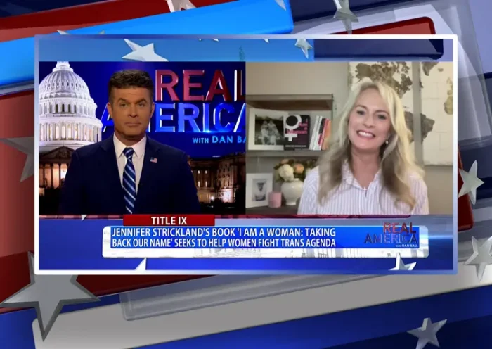 Video still from Real America on One America News Network showing a split screen of the host on the left side, and on the right side is the guest, Jennifer Strickland.