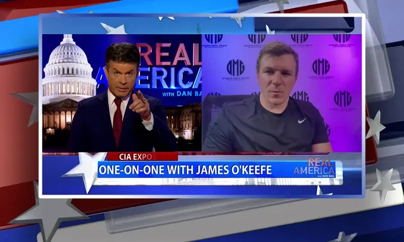 Video still from Real America on One America News Network showing a split screen of the host on the left side, and on the right side is the guest, James O'Keefe.