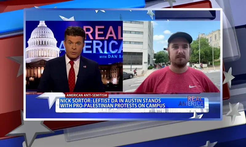 Video still from Real America on One America News Network showing a split screen of the host on the left side, and on the right side is the guest, Nick Sortor.
