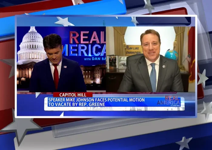 Video still from Real America on One America News Network showing a split screen of the host on the left side, and on the right side is the guest, Rep. Pat Fallon.