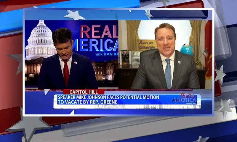 Video still from Real America on One America News Network showing a split screen of the host on the left side, and on the right side is the guest, Rep. Pat Fallon.