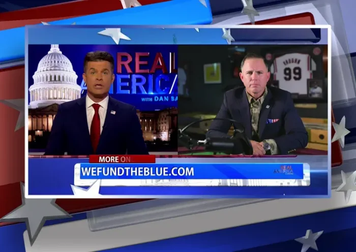 Video still from Real America on One America News Network showing a split screen of the host on the left side, and on the right side is the guest, John Rourke.
