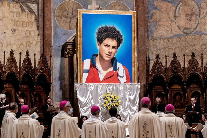 Beatification Of Carlo Acutis
ASSISI, ITALY - OCTOBER 10: A tapestry featuring a portrait of Carlo Acutis is hang at the St. Francis Basilica during the beatification ceremony of Carlo Acutis, on October 10, 2020 in Assisi, Italy. The fifteen-year-old Carlo Acutis member of the Millennial generation who died on 12 October 2006 from M3 fulminant leukemia, is considered a 