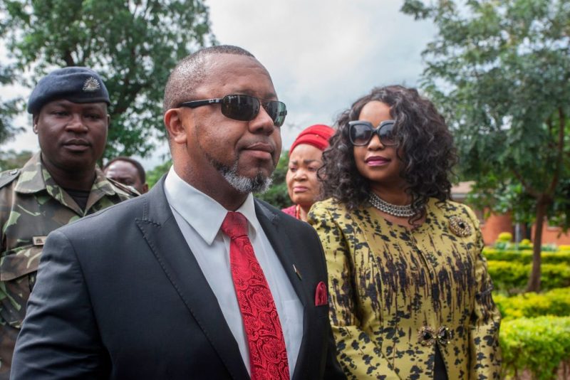 Former Malawi Vice President, Saulos Klaus Chilima (2nd L), who is now president for the United Transformation Movement (UTM) Party and who is the first petitioner in the Malawi Elecions Case, is accompanied by his wife Mary Chilima (R), waits to be screened at the Lilongwe High Court, where constitutional court judges will preside over the ruling on whether to annul the controversial vote that saw Malawi President Peter Mutharika re-elected in the May 2019 election, in Lilongwe on February 3, 2020. (Photo by AMOS GUMULIRA / AFP) (Photo by AMOS GUMULIRA/AFP via Getty Images)