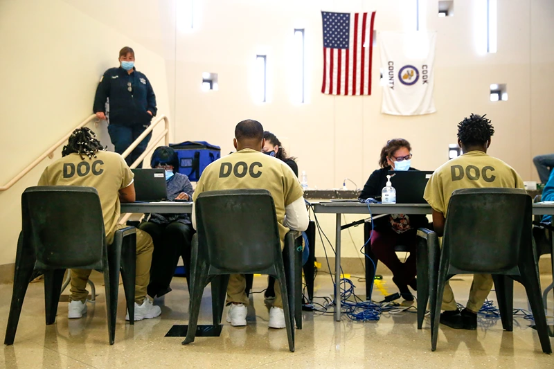 Cook County Jail Detainees Participate In Early Voting
CHICAGO, ILLINOIS - OCTOBER 17: Cook County jail detainees check in before casting their votes after a polling place was opened in the facility for early voting on October 17, 2020 in Chicago, Illinois. It is the first time pretrial detainees in the jail will get the opportunity for early voting in a general election. (Photo by Nuccio DiNuzzo/Getty Images)