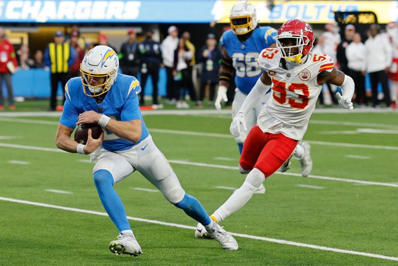 INGLEWOOD, CALIFORNIA - JANUARY 07: Easton Stick #2 of the Los Angeles Chargers runs the ball in the fourth quarter during a game against the Kansas City Chiefs at SoFi Stadium on January 07, 2024 in Inglewood, California. (Photo by Kevork Djansezian/Getty Images)