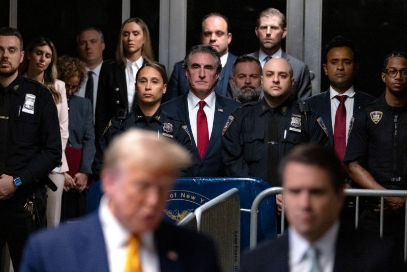 NEW YORK, NEW YORK - MAY 14: Supporters of former U.S. President Trump, including North Dakota Governor Doug Burgum (C), U.S. Rep. Cory Mills (R-FL) (C-R) and businessman Vivek Ramaswamy (2nd-R) listen as Trump speaks to the media at the end of the day's proceedings in his trial for allegedly covering up hush money payments linked to an extramarital affair with Stormy Daniels, at Manhattan Criminal Court on May 14, 2024 in New York City. Former U.S. President Donald Trump faces 34 felony counts of falsifying business records in the first of his criminal cases to go to trial. (Photo by Craig Ruttle - Pool/Getty Images)