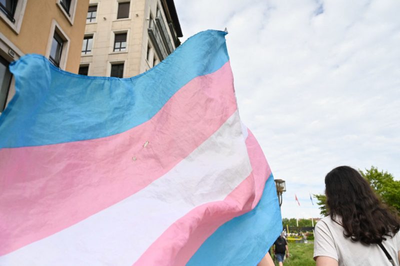 A transgender flag flies during a demonstration for trans rights in Lyon, France on 25 May 2024. (Photo by Matthieu Delaty / Hans Lucas / Hans Lucas via AFP) (Photo by MATTHIEU DELATY/Hans Lucas/AFP via Getty Images)