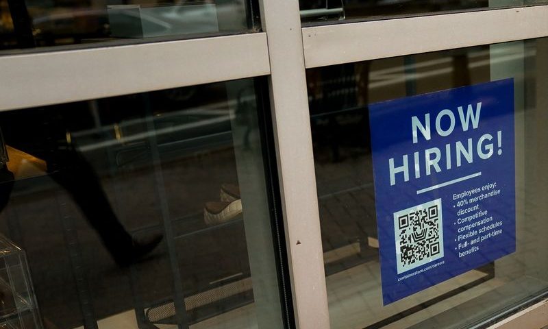 FILE PHOTO: An employee hiring sign with a QR code is seen in a window of a business in Arlington, Virginia, U.S., April 7, 2023. REUTERS/Elizabeth Frantz