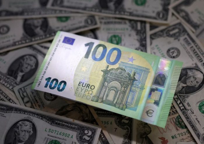 Illustration shows Euro and U.S. dollar banknotes