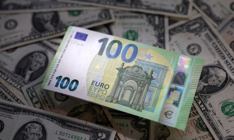 Illustration shows Euro and U.S. dollar banknotes