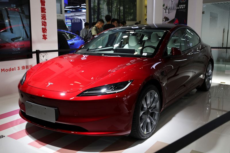 Tesla unveils revamped Model 3 sedan at Beijing trade fair.